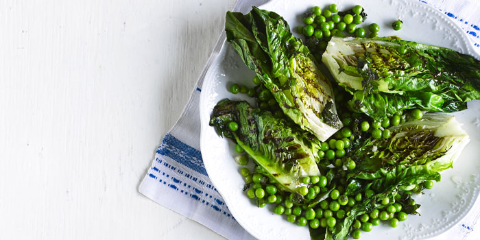 Griddled lettuce and peas on a plate